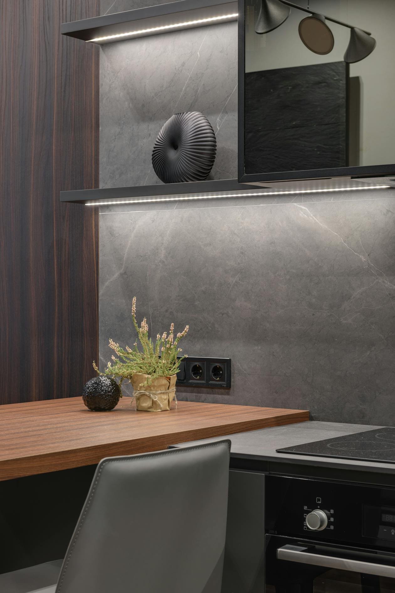 Small studio apartment kitchen with open-plan living area and clean counters
