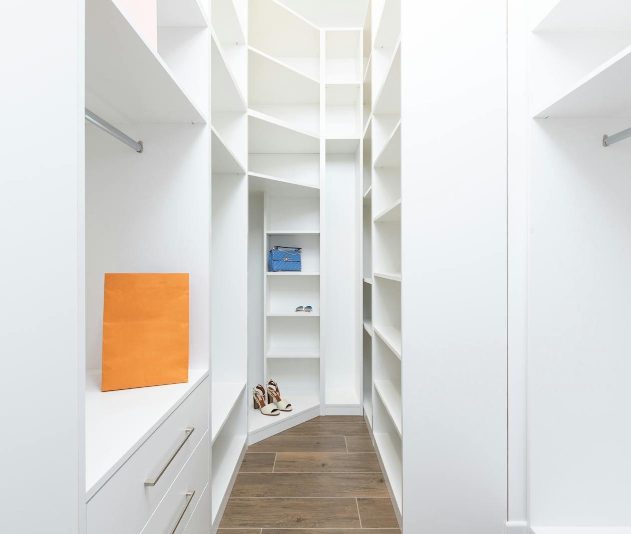Organized white shelving and closet storage in an apartment